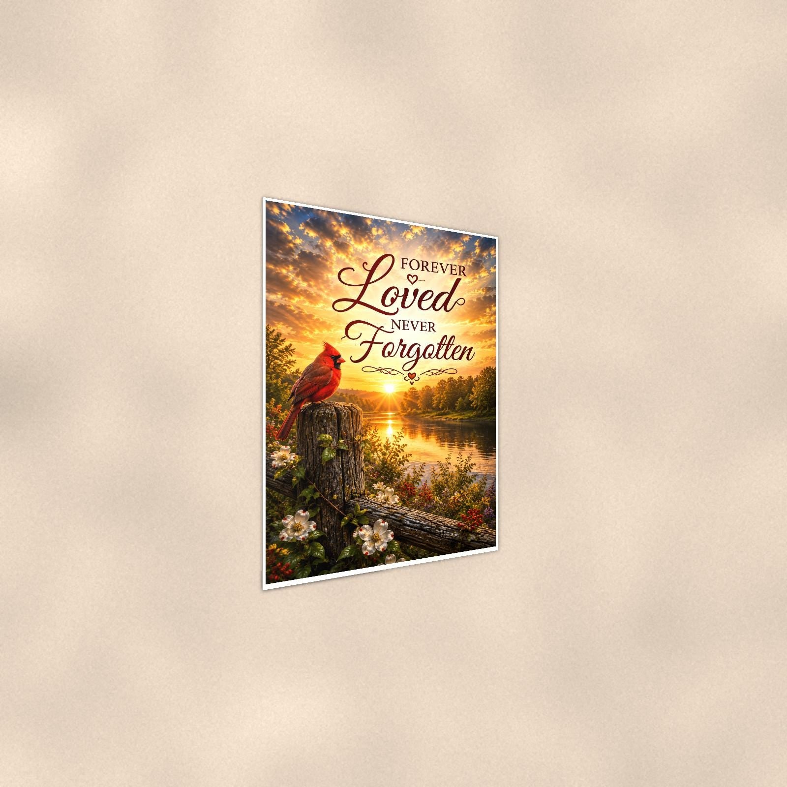 Cardinal at sunrise over the river memorial art titled "Forever Loved Never Forgotten" on a 24x36 inch luster poster print with a clean white border, shown at a gentle angle from the other side