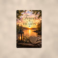Lakeside lantern and heart stone memorial art titled "Forever In Our Hearts" on a 8x12 inch sublimated aluminum sign with rounded corners and mounting holes, shown straight on against a warm neutral wall
