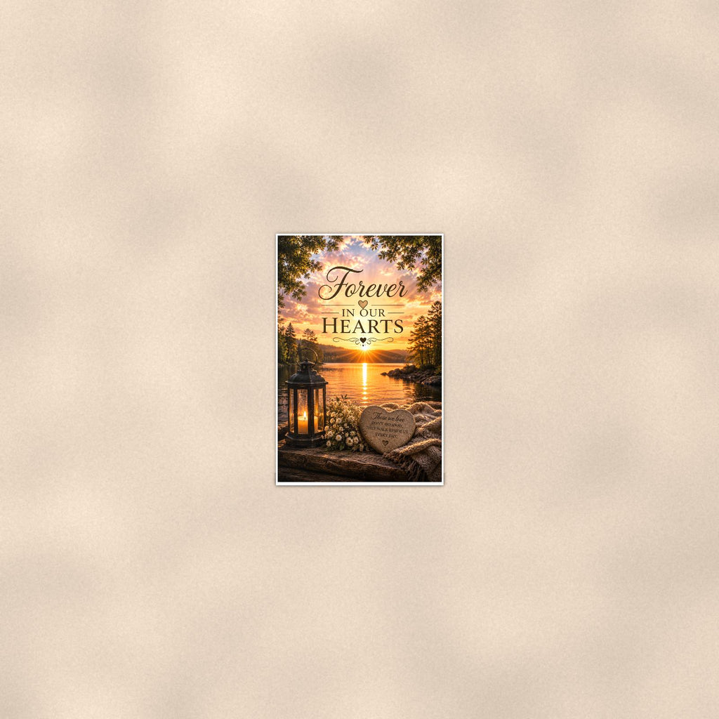 Lakeside lantern and heart stone memorial art titled "Forever In Our Hearts" on a 24x36 inch luster poster print with a clean white border, seen from farther back, small on a softly lit wall