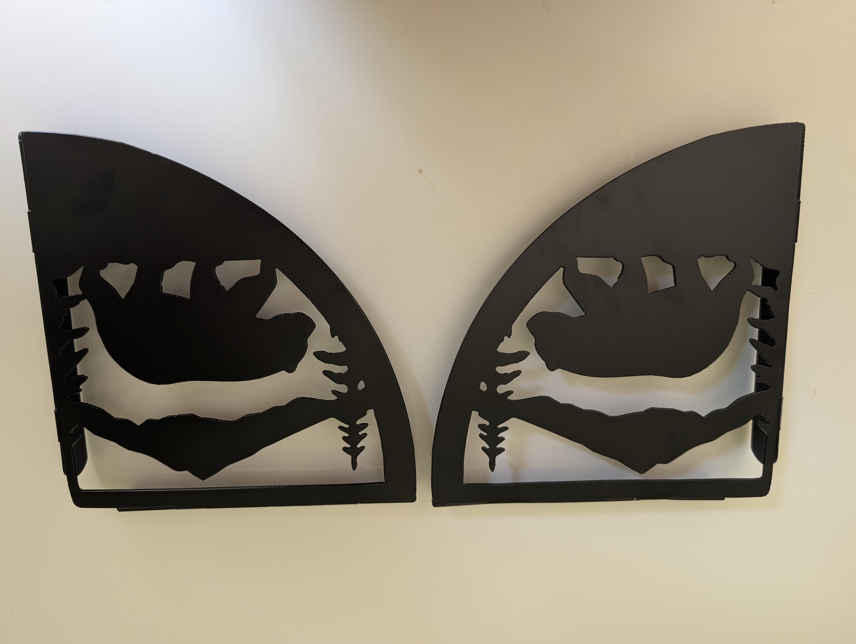 Left and right mountain bear shelf brackets standing upright as a facing pair