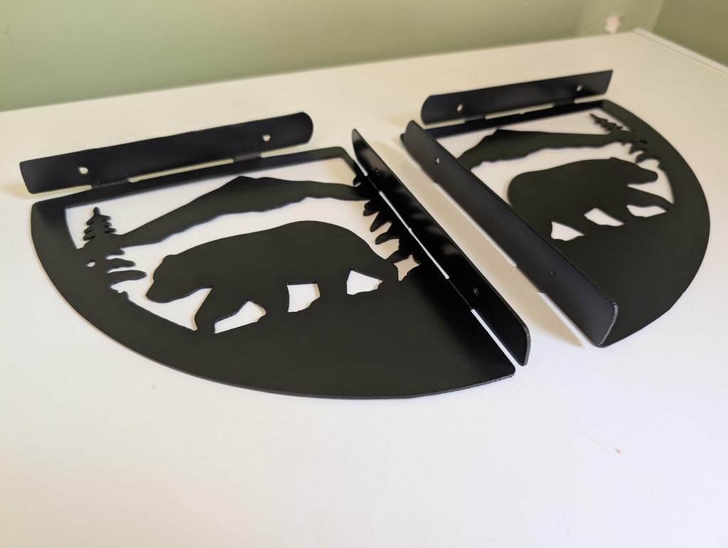 Bear shelf bracket pair laid out with mounting bars visible, showing the screw slots