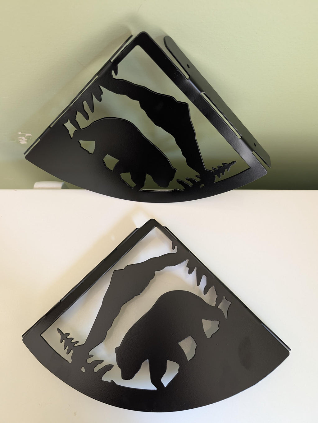 Mountain bear shelf bracket pair mounted high on a wall corner