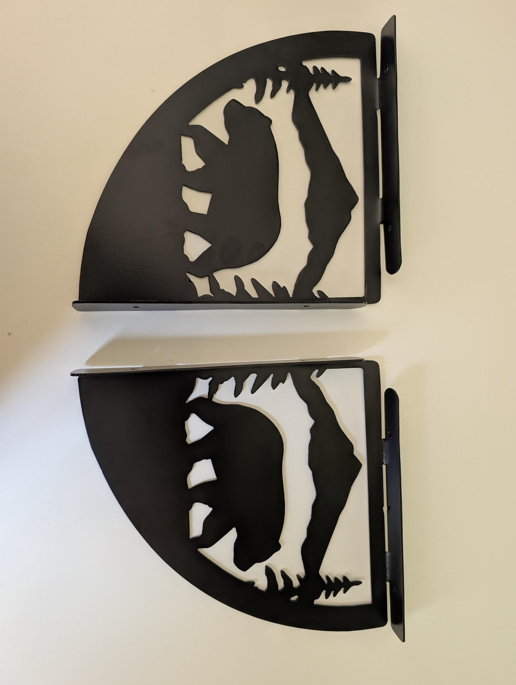 Two mountain bear shelf brackets stacked, showing the quarter-round profile