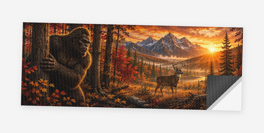 Full flat view of the Bigfoot Tree Peeker Autumn perforated truck window decal on a white background, one corner curled to show the black perf-vinyl backing and the micro-hole pattern