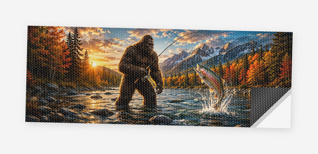 Full flat view of the Bigfoot Gone Fishing perforated truck window decal on a white background, one corner curled to show the black perf-vinyl backing and the micro-hole pattern