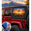 Jeep Wrangler 4-door rear quarter window with a perforated decal of a wooden cross draped with cloth on a mountaintop at sunrise, sun rays breaking through the clouds, applied to the outside of the glass. An INCLUDED badge in the corner shows the felt squeegee and 2 American flag decals that come with every set.