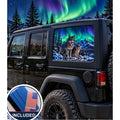 Jeep Wrangler 4-door rear quarter window with a perforated decal of two wolves standing on a snowy rock under green and purple northern lights, snow-capped mountains and pine trees in the scene, applied to the outside of the glass. An INCLUDED badge in the corner shows the felt squeegee and 2 American flag decals that come with every set.