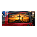 Jeep Wrangler 2-door rear side window with a perforated decal of three wooden crosses silhouetted on a hill at a fiery orange sunset, applied to the outside of the glass. An INCLUDED badge in the corner shows the felt squeegee and 2 American flag decals that come with every set.